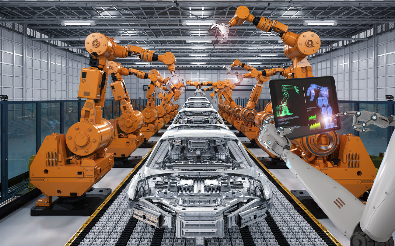 Robotic arms on a factory assembly line